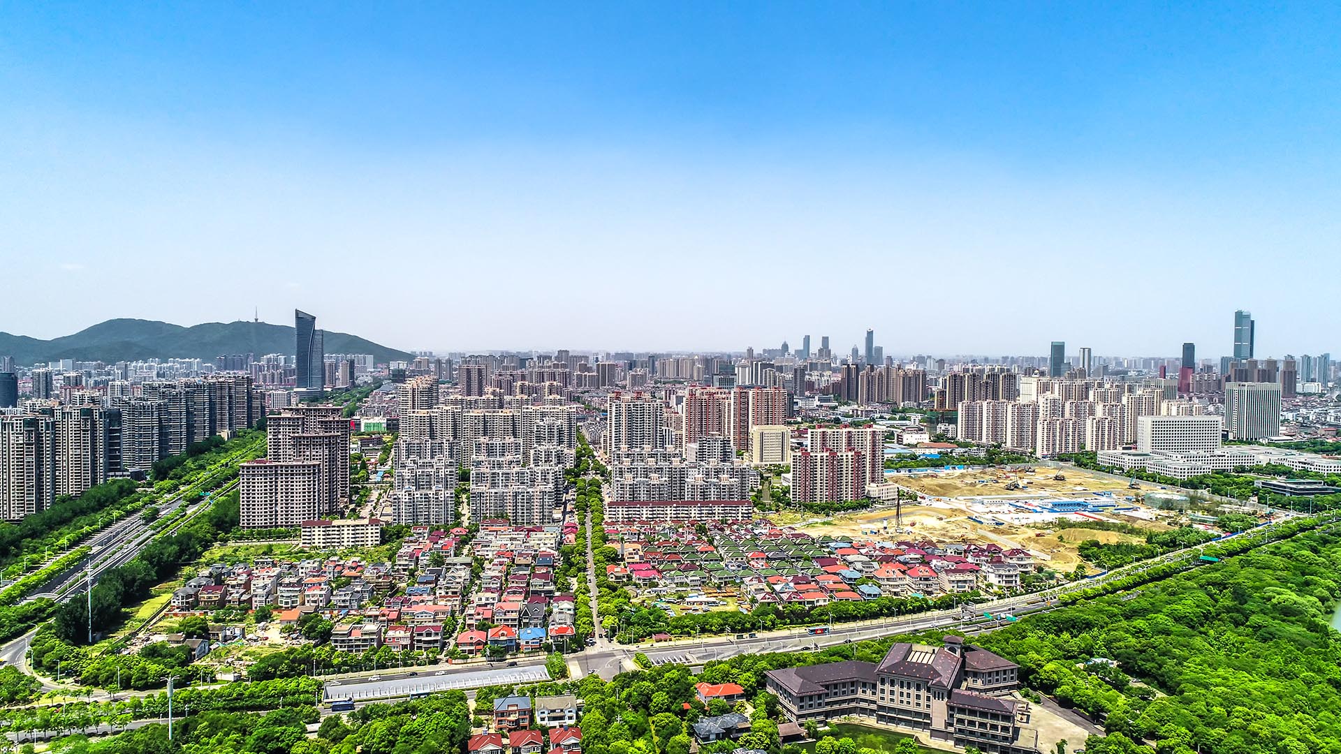 Construction site with cranes representing industrial ERP context